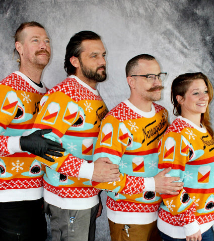 Narragansett Brewing Company team posing in custom Christmas sweaters made by Roody sustainable swag