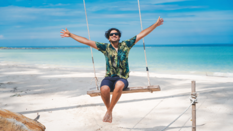 Summer Box custom Hawaiian shirt man on swing at beach happy branded swag corporate gifts