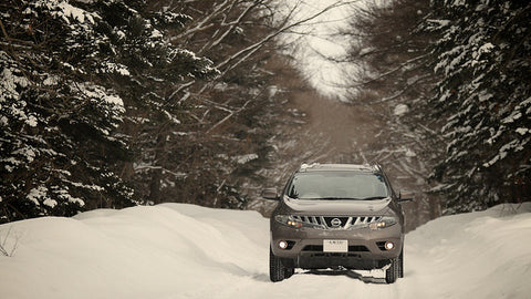 car in deep snow 