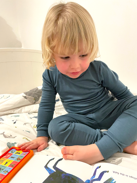 Bedtime reading wearing merino pyjamas