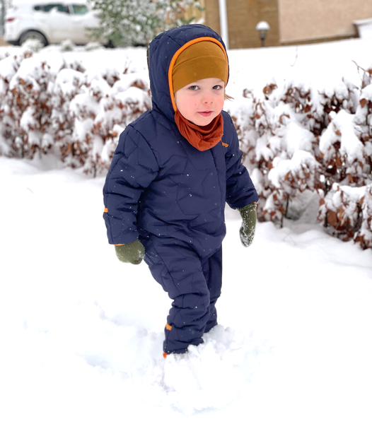 Toddler in deep snow