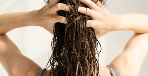 girl with hands in her damp hair