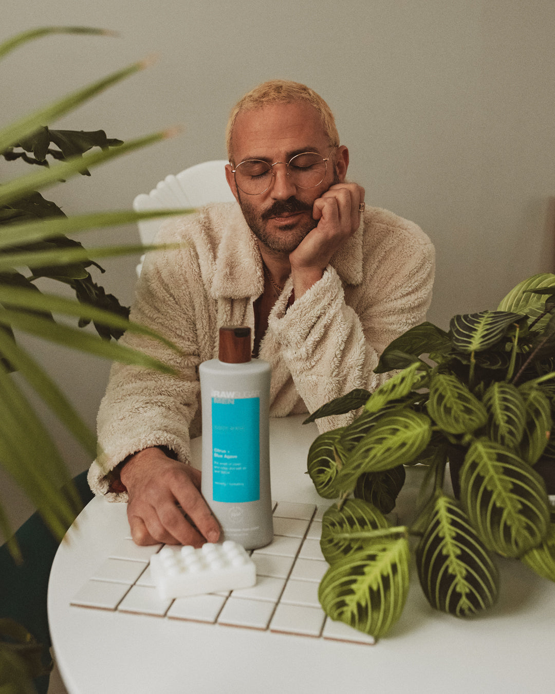 guy in robe with men's product