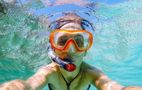 person snorkeling under water