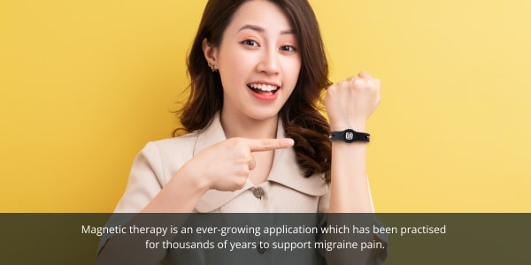 YOU Streamz migraine blog image. Women with magnetic therapy wristband to help with migraine pain.