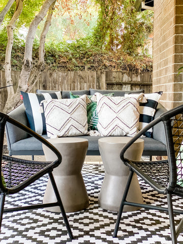 Outdoor sitting area mixing prints, patterns and texture.