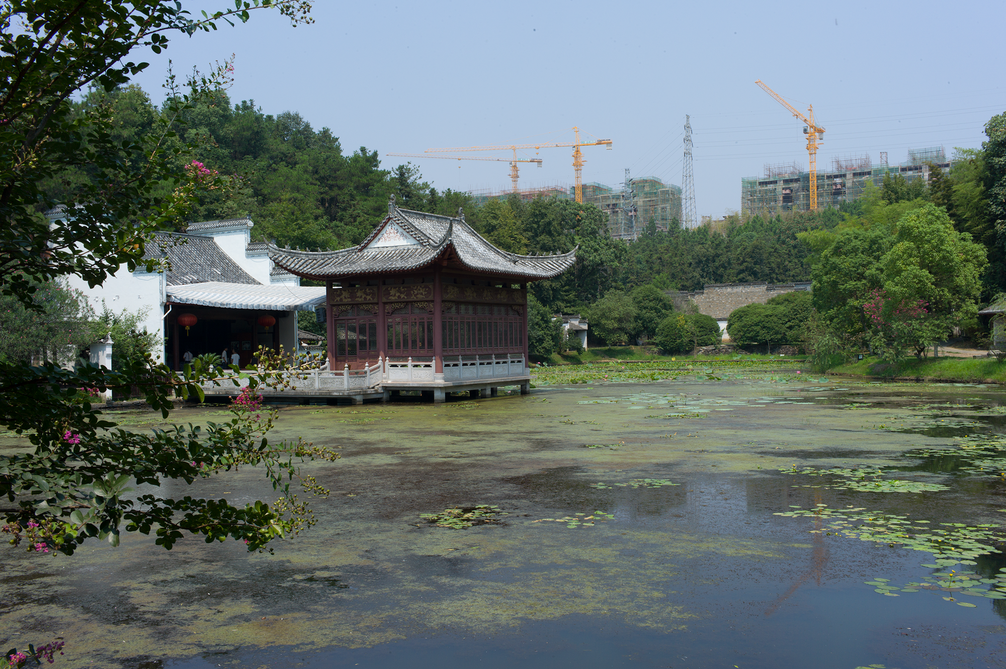 Ancient buildings with a high-rise backdrop