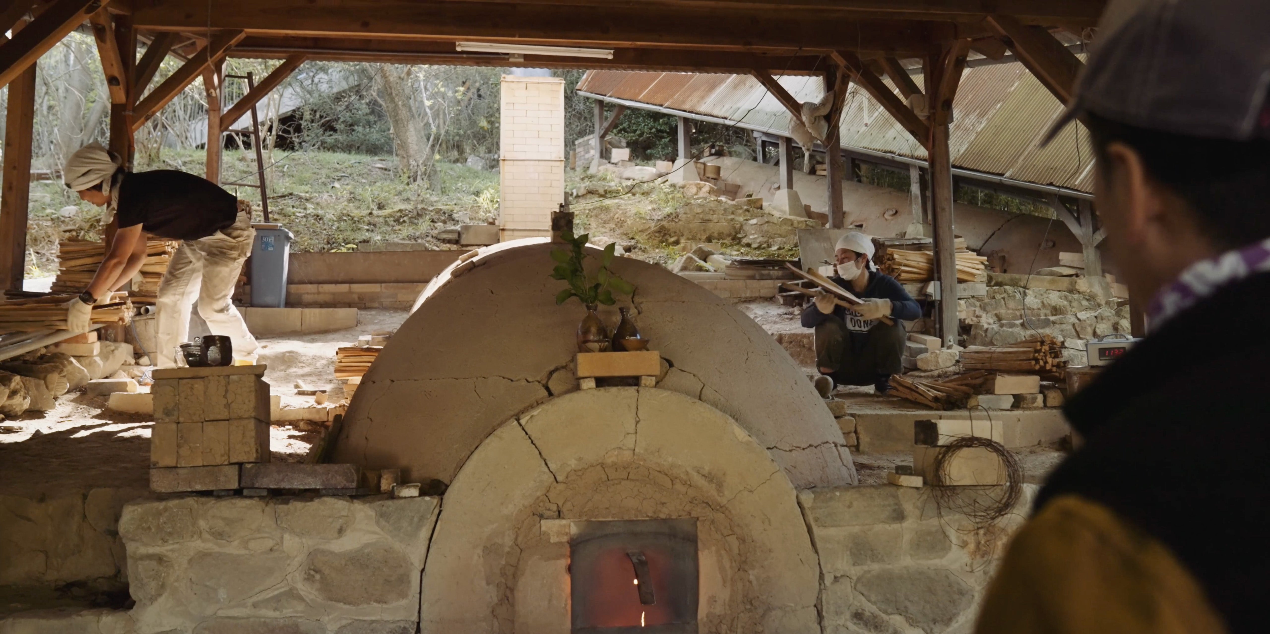 Koichiro Isezaki and colleagues and his wood firing kiln
