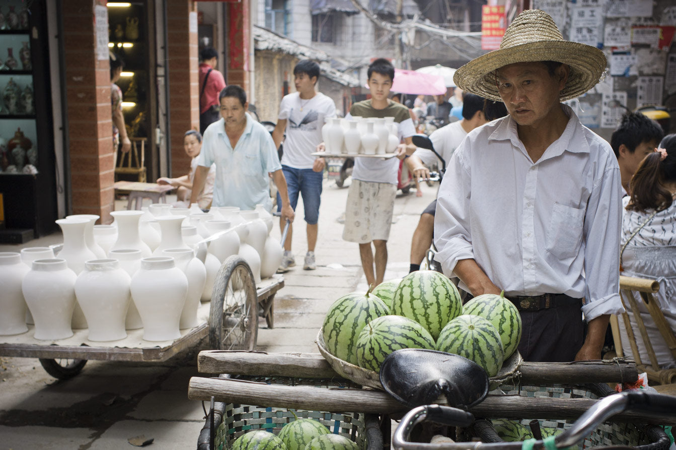 Jingdezhen’s vital porters transport pots at different stages of completion through streets lined with antiques shops