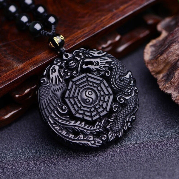 Black obsidian pendant with Yin-Yang in the center and areas of Bagua