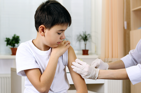 child receiving vaccine