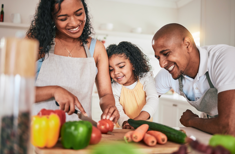 Family cooking healthy food together