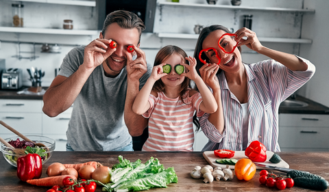 Family being silly in the kitchen