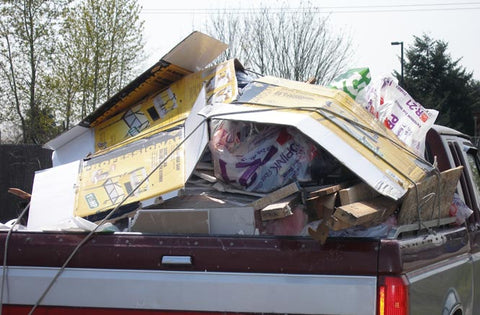 Unsecured load in the back of truck on roadway. Unsafe! Gladiator Cargo Nets solutions 