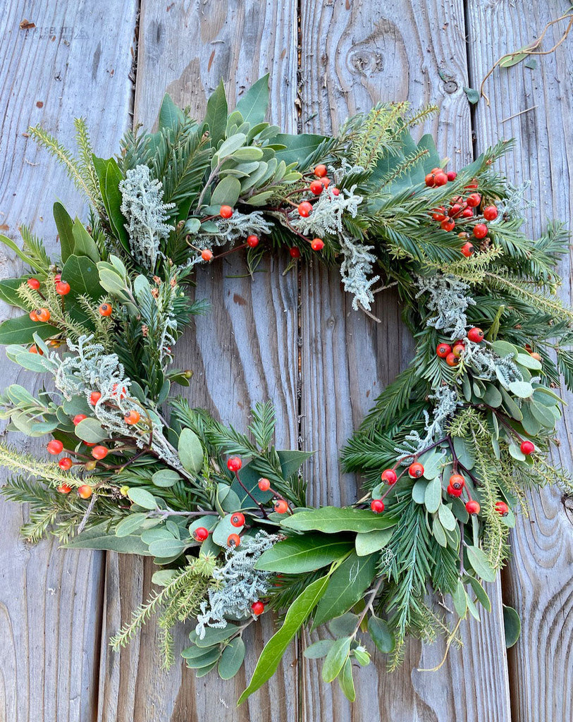 Wreath with evergreens and red berries