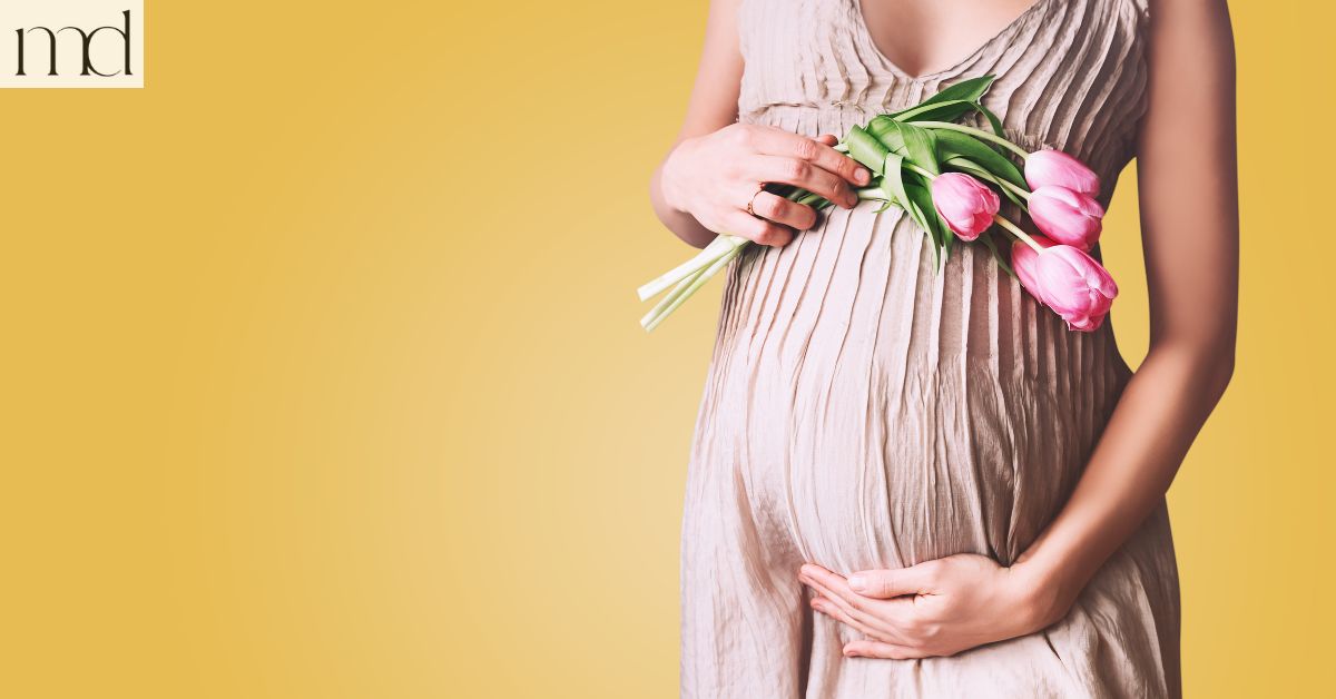 pregnant belly with flower tulips