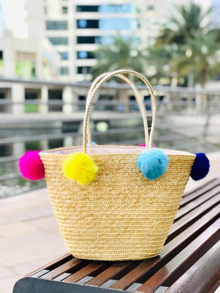 Golden Handle with colorful pompoms basket