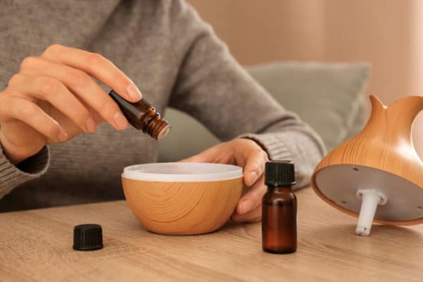 Diffuser or Nebulizer being filled with essential oils