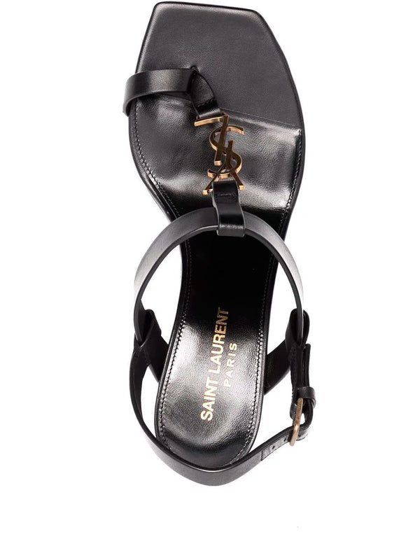 Luxury shoes for women - Saint Laurent Cassandra black leather flat sandals