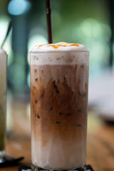 Iced macchiato in a glass with milk 