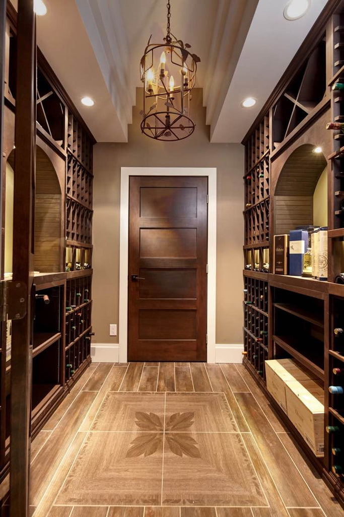 Looking directly at the wine cellar towards the door, one can see both sets of racking on the right and left with the fabulous chandelier above.