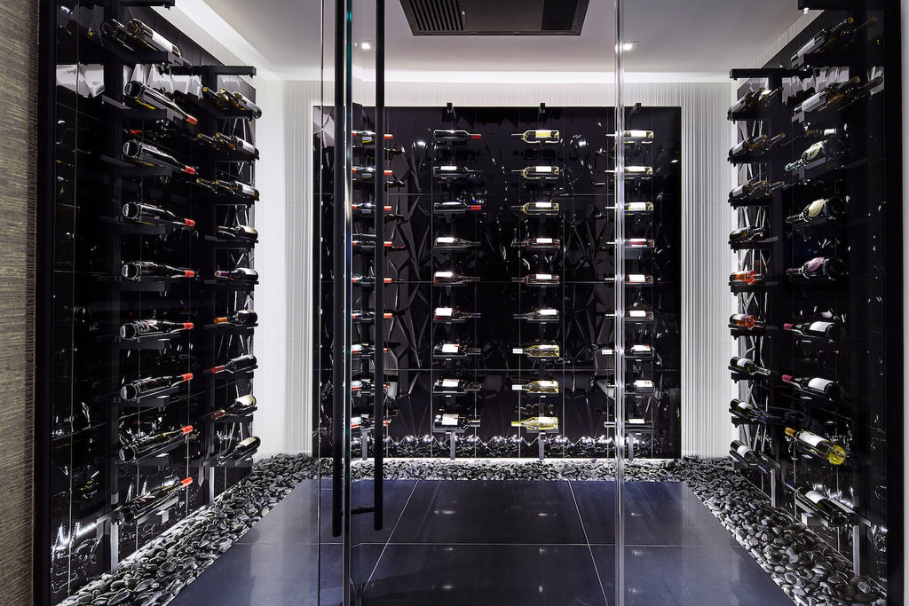 Looking through glass to contemporary wine cellar in black.