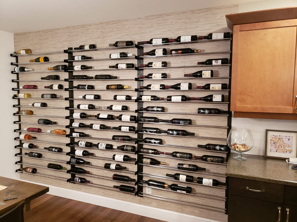 Single Bottle Deep Evolution Wine Wall in a Rec Room Area