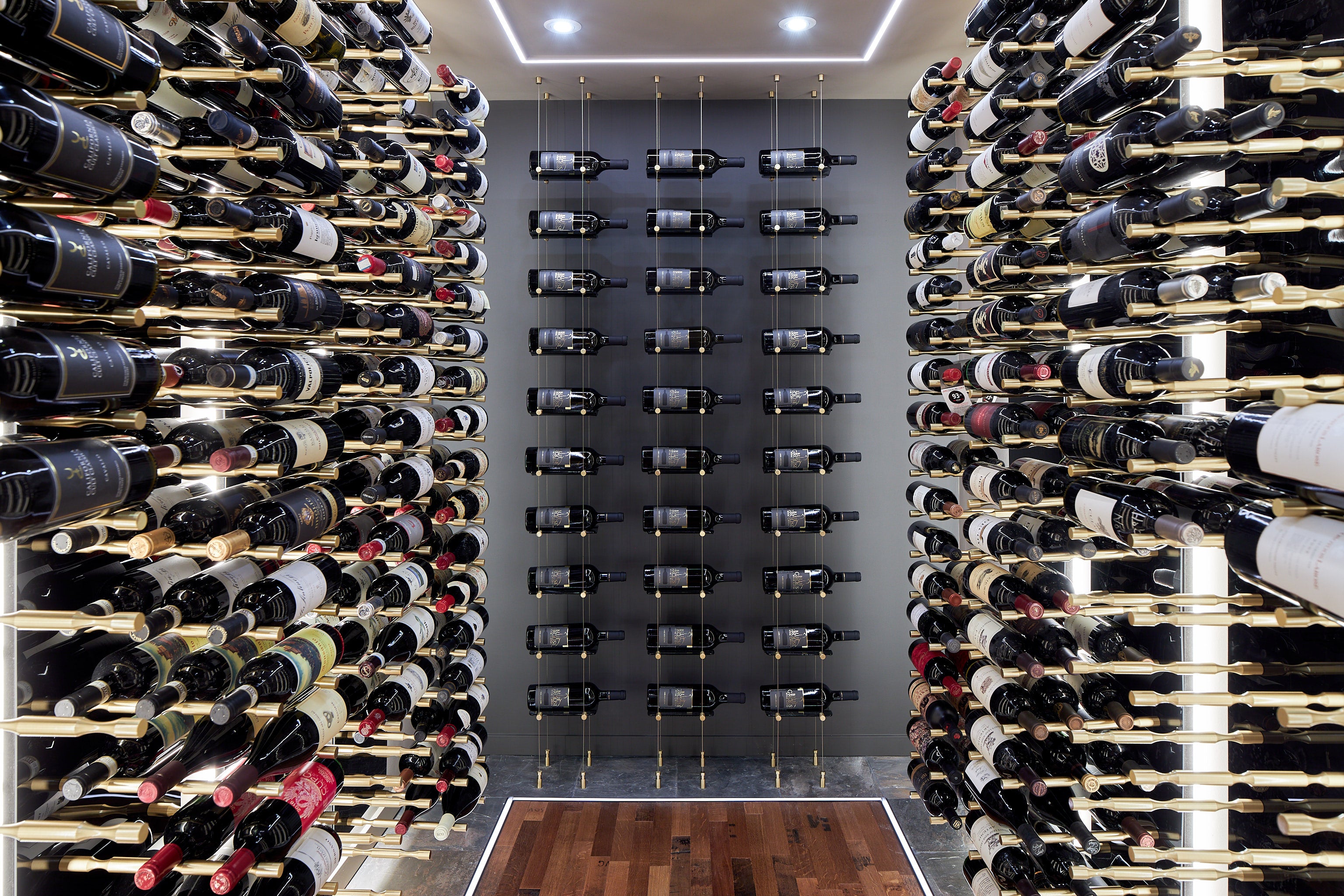 Modern Wine Cellar with Gold Hardware