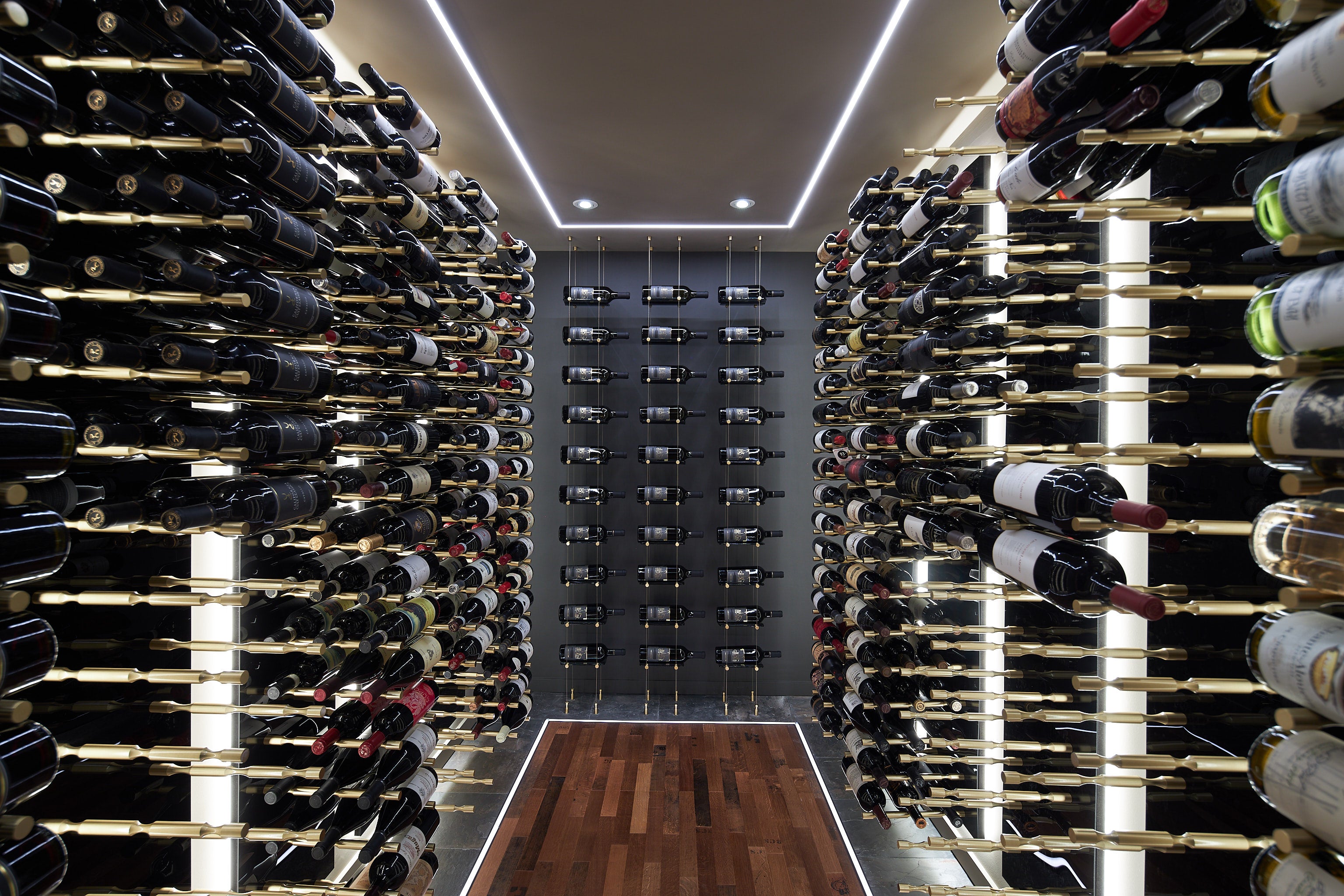 Modern Wine Cellar with Gold Hardware