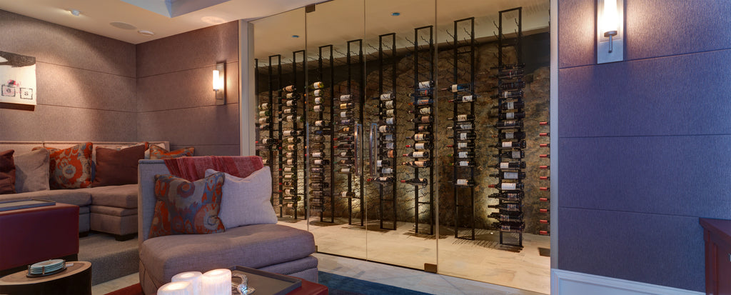 Floor to Ceiling Wine Racks in a Glass Wine Cellar