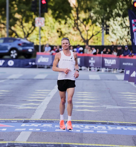 man running a marathon on a street