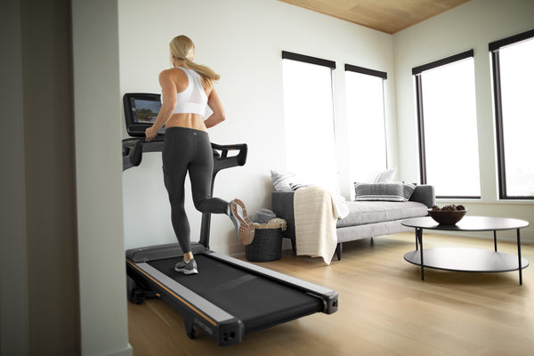 blond woman running on a treadmill