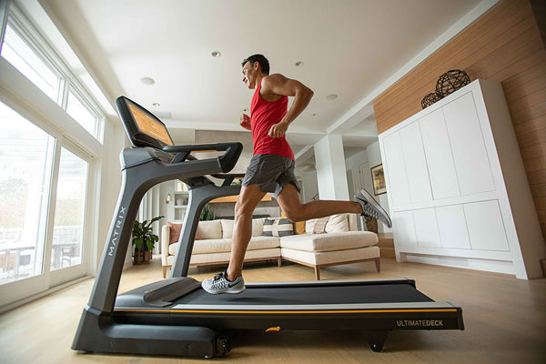 man running on treadmill