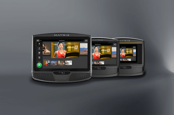 group of touchscreen consoles on gray background