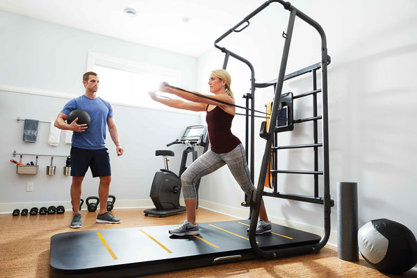 woman exercising with a home gym machine