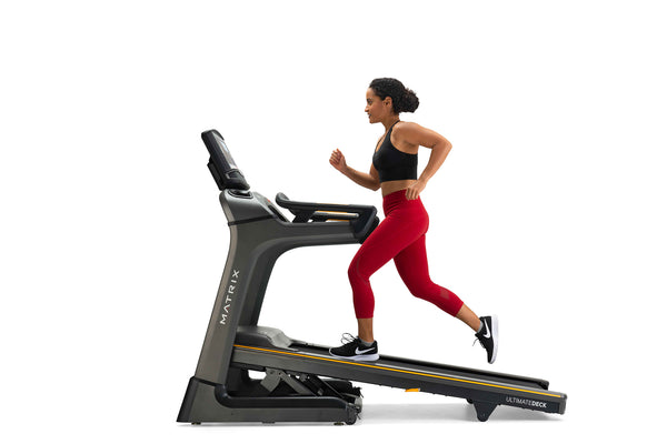 woman running on folded treadmill with incline