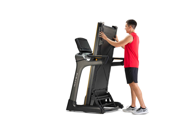 man folding high-end treadmill