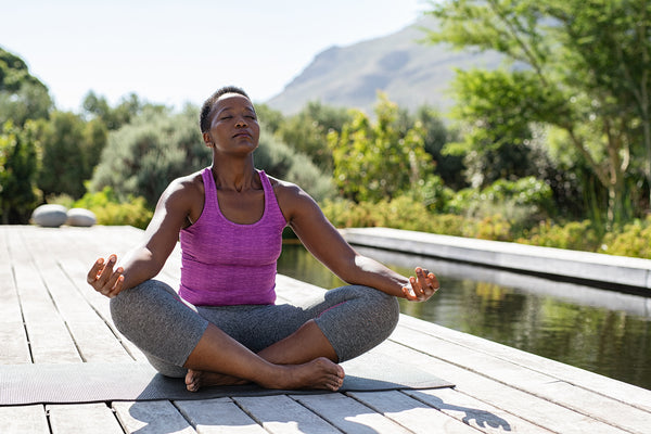 woman sitting cross leg meditating