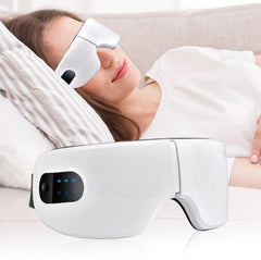 A woman wearing a smart eye massager laying down getting an eye massage