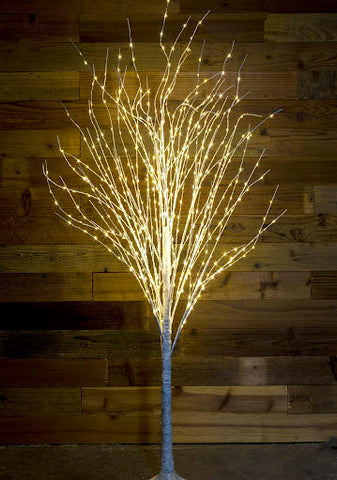 a Festive LED Branch Christmas tree illuminated by white lights.