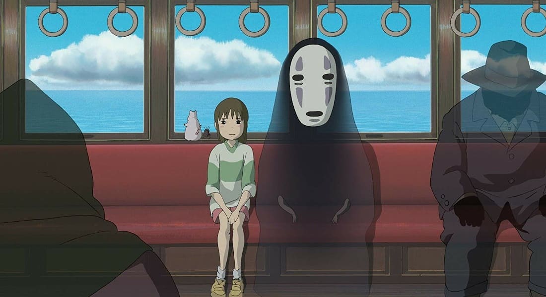 Chihiro avec un esprit sans visage dans un train