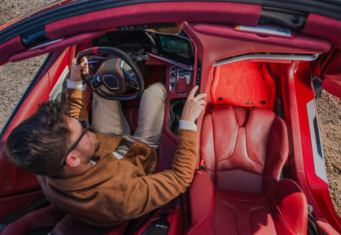 a red car equipped with a red car floor mat