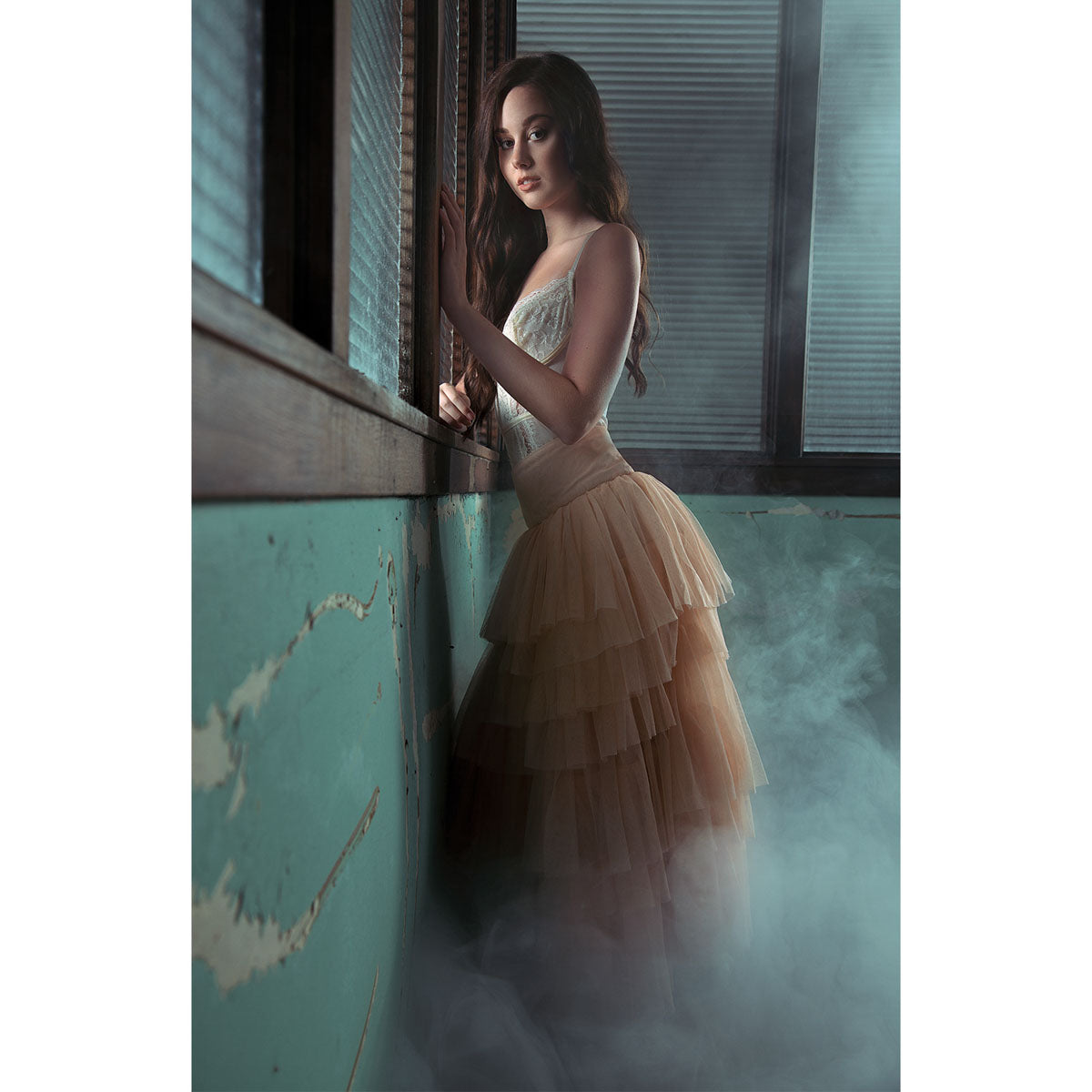 Studio shot of a model with smoke machine in the background