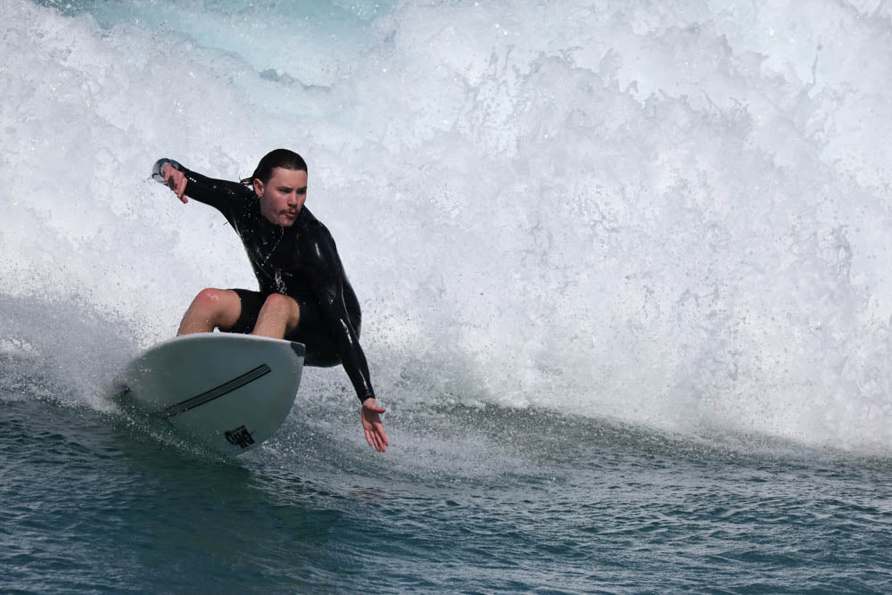 Surfer in Australia riding out of a small wave