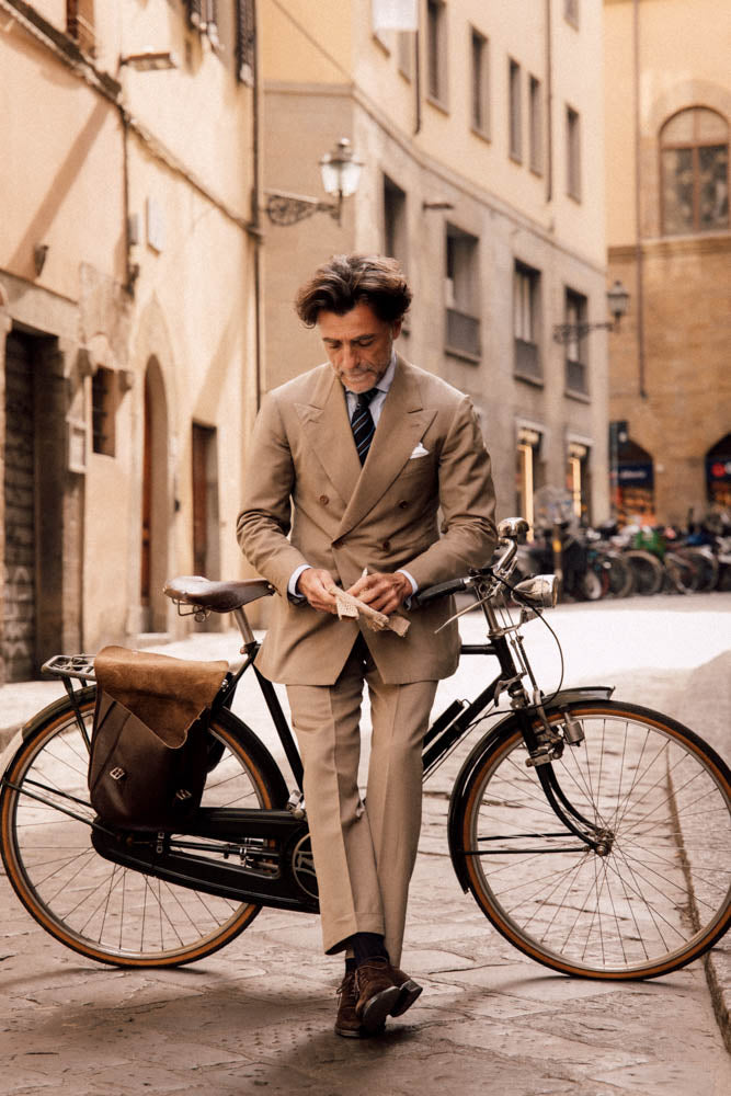 Sample photo of a smartly dressed man by his bicycle
