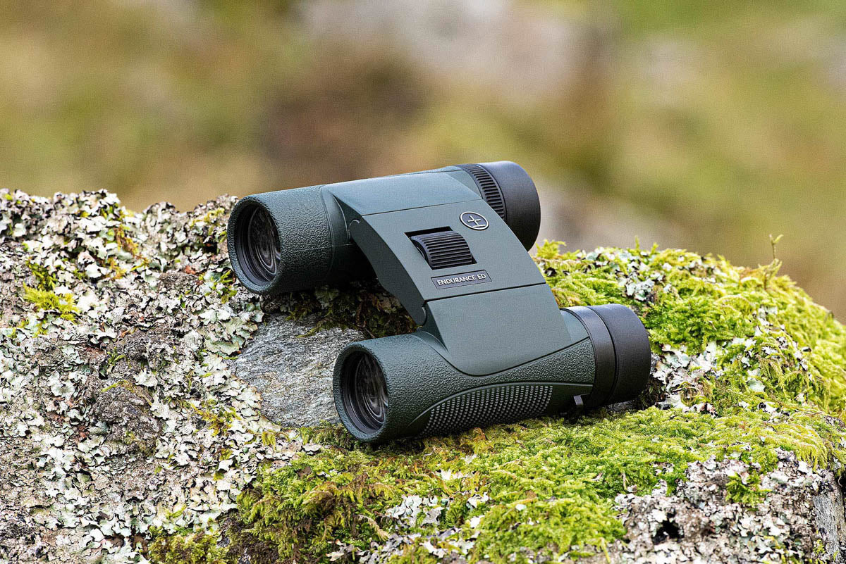 Lifestyle photo of the binoculars resting on a rock