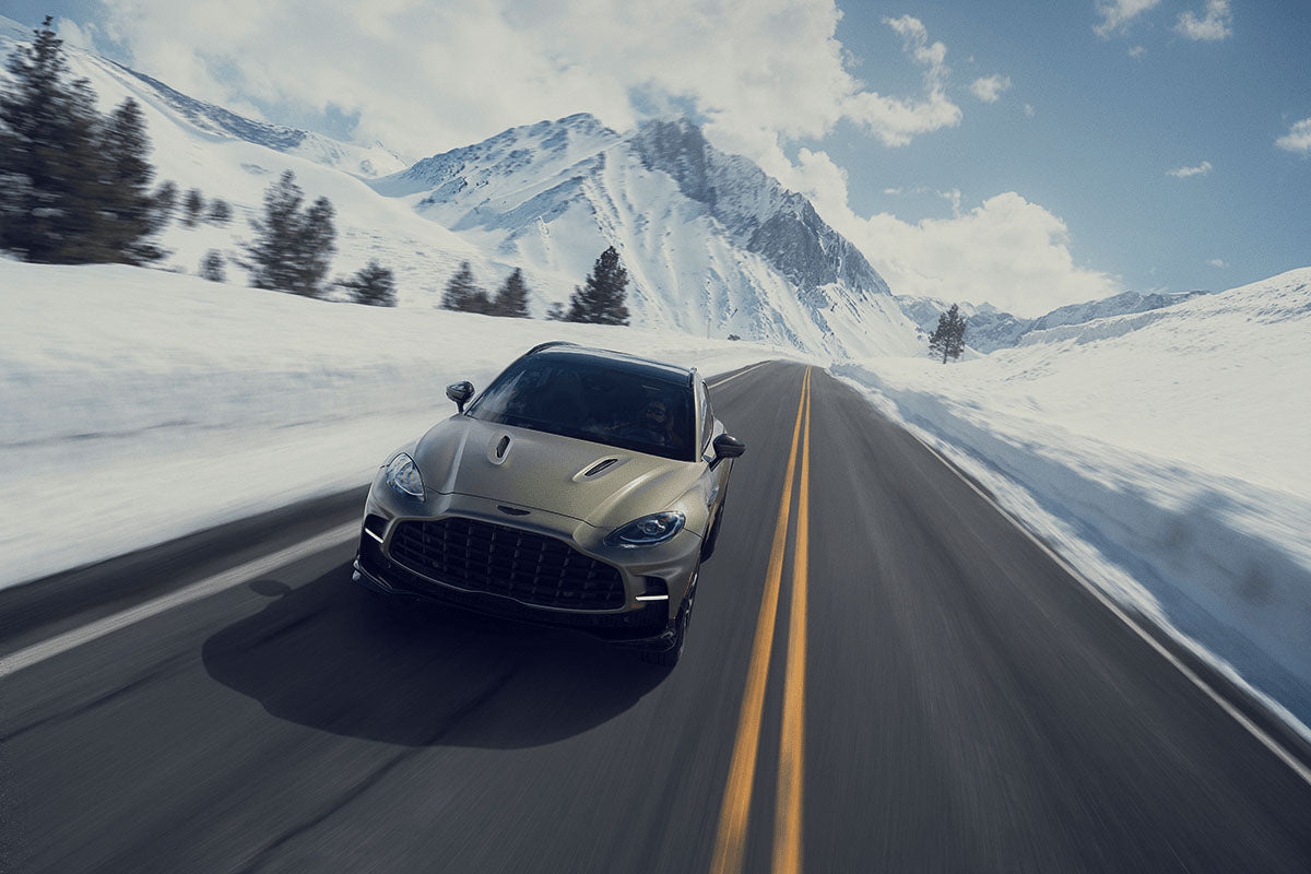Photo of a fast moving car in the mountains in the snow taken on the GFX 100II