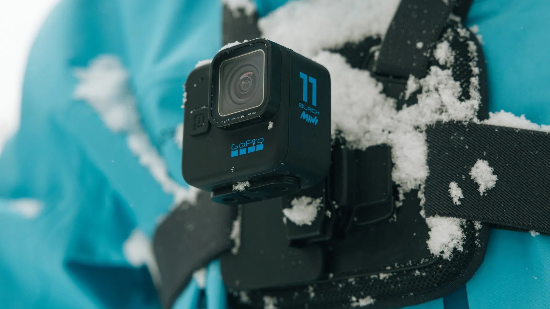 Product shot of the chest mount in use in the snow with a gopro hero 11 attached