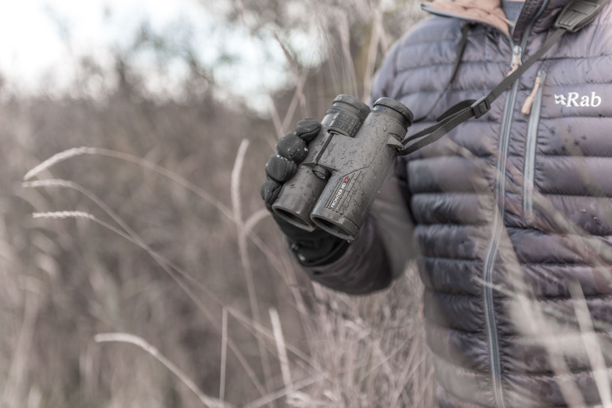 Handheld lifestyle photo of the binoculars in use