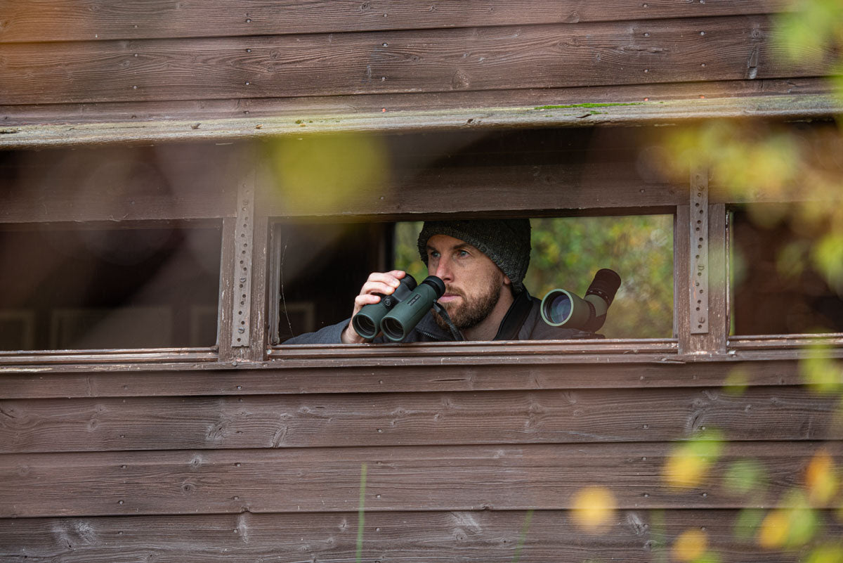 Lifestlye photo of a birdwatcher using the binoculars